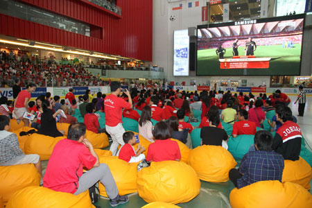 Fans watch World Cup match on the huge LED screen at Dubai Ice Rink