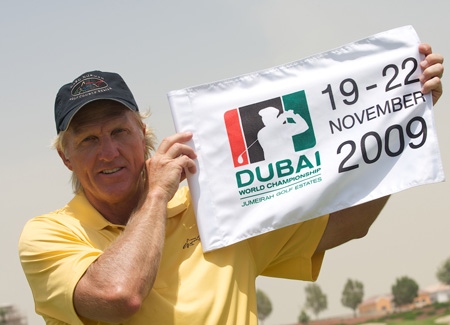 Greg Norman with the banner of Dubai World Championship