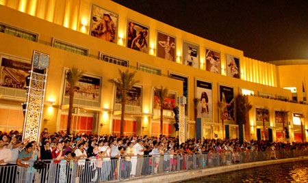 Visitors throng The Dubai Fountain which lines the Waterfront Promenade